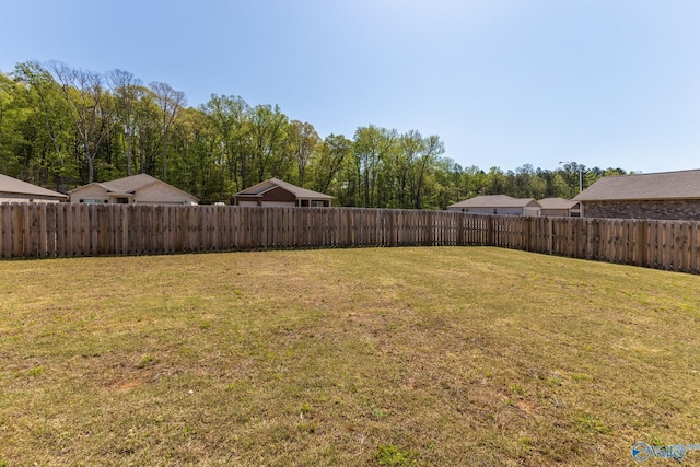 view of yard with a fenced backyard