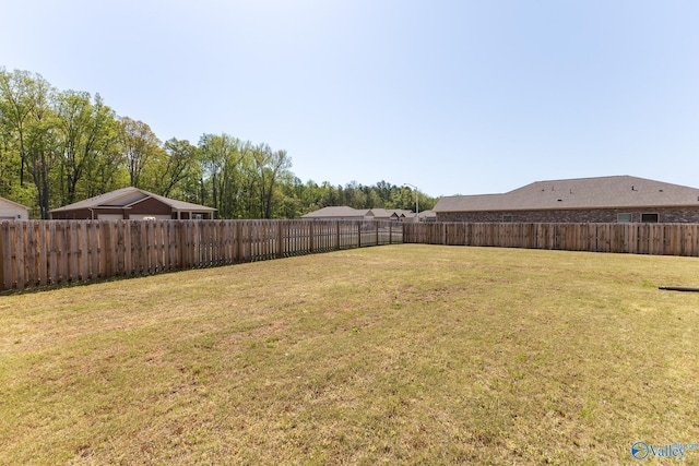 view of yard with a fenced backyard