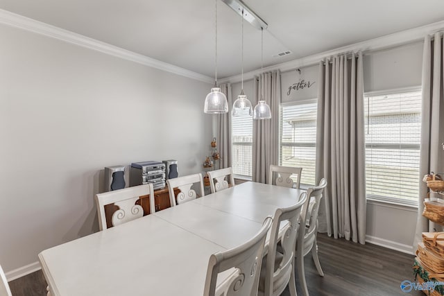 dining space with visible vents, dark wood-style flooring, baseboards, and crown molding