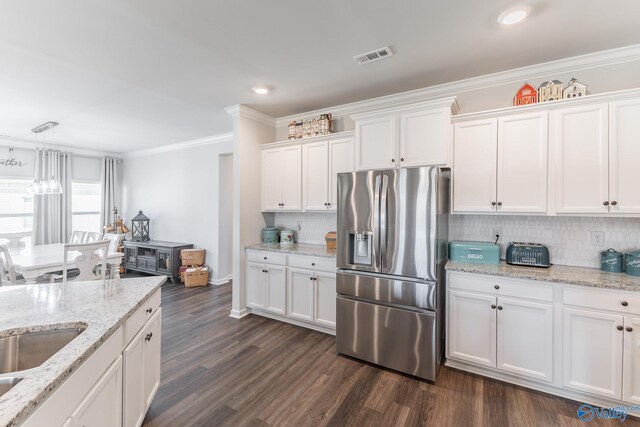 kitchen featuring white cabinets, dark wood finished floors, visible vents, and stainless steel fridge with ice dispenser