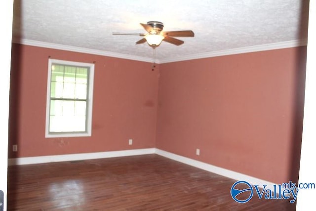 spare room featuring a textured ceiling, crown molding, dark hardwood / wood-style flooring, and ceiling fan