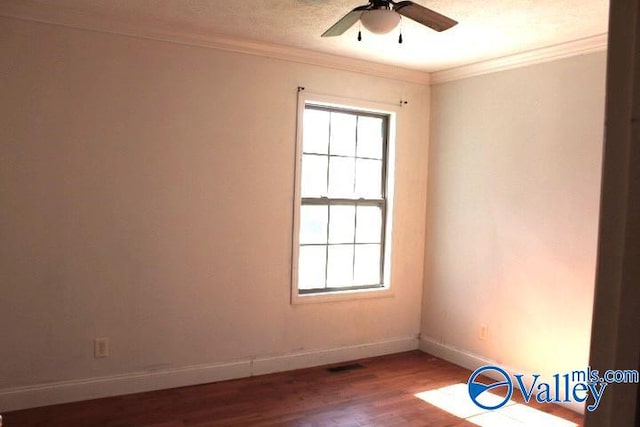 unfurnished room with ceiling fan, ornamental molding, and wood-type flooring