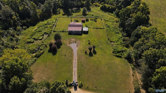 birds eye view of property with a rural view