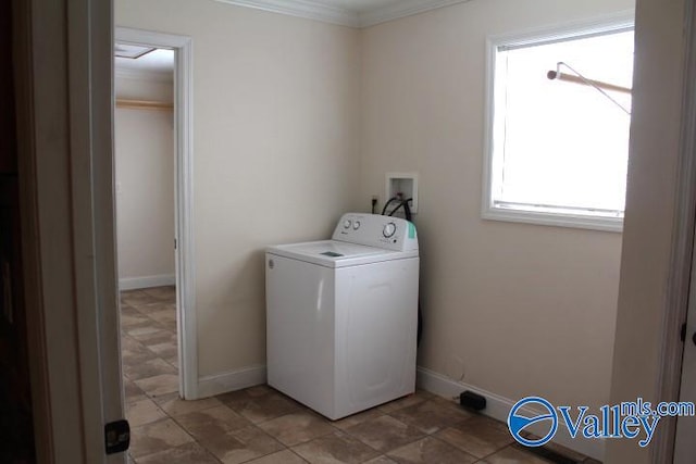 laundry room featuring washer / clothes dryer and crown molding