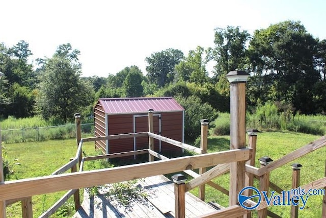 exterior space with a storage shed and a deck