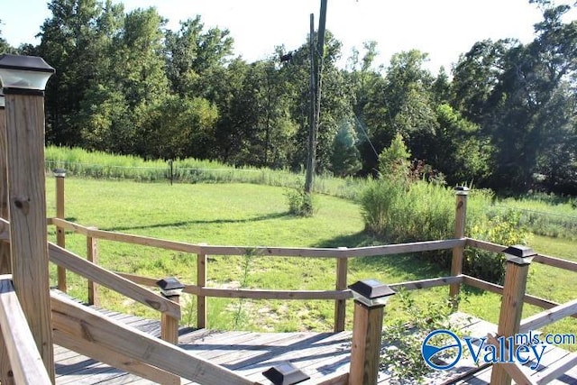 view of yard featuring a wooden deck