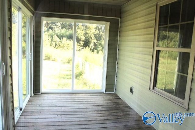 unfurnished sunroom featuring a wealth of natural light