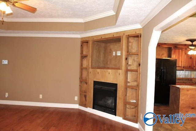 unfurnished living room with ornamental molding, a textured ceiling, ceiling fan, and dark hardwood / wood-style flooring