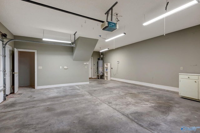 garage featuring a garage door opener, gas water heater, and baseboards