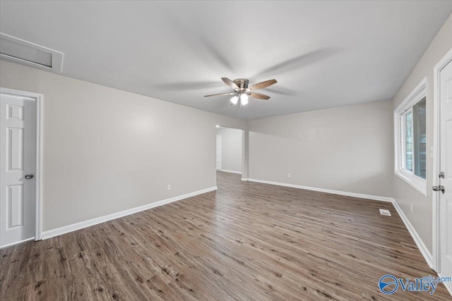 empty room with ceiling fan and wood-type flooring