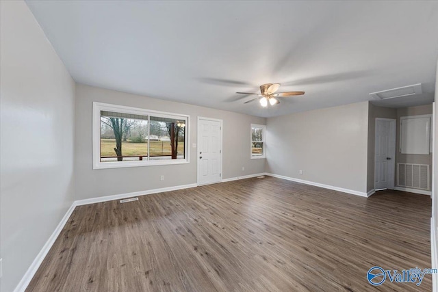 spare room featuring dark hardwood / wood-style floors and ceiling fan