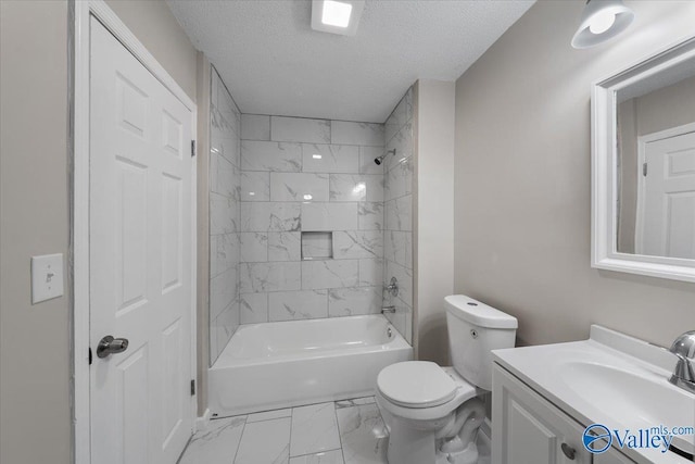 full bathroom with vanity, toilet, tiled shower / bath combo, and a textured ceiling