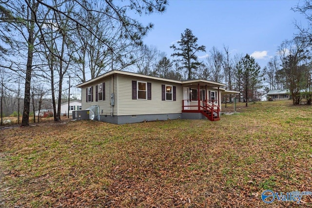 view of front of home with a porch and a front yard