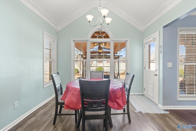 dining area with lofted ceiling, crown molding, dark hardwood / wood-style flooring, and a chandelier