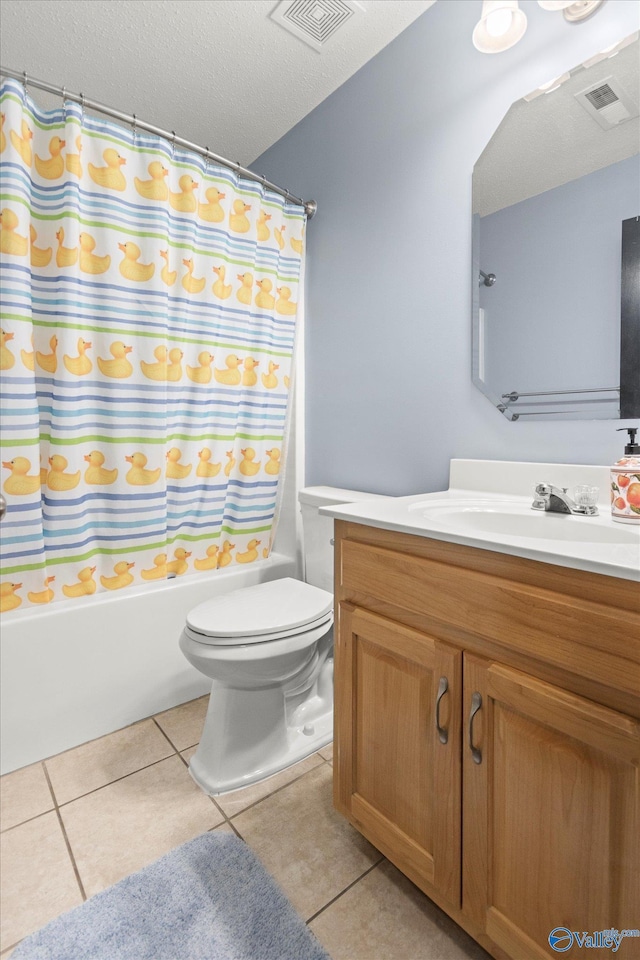 full bathroom with shower / bath combo, tile patterned flooring, vanity, a textured ceiling, and toilet