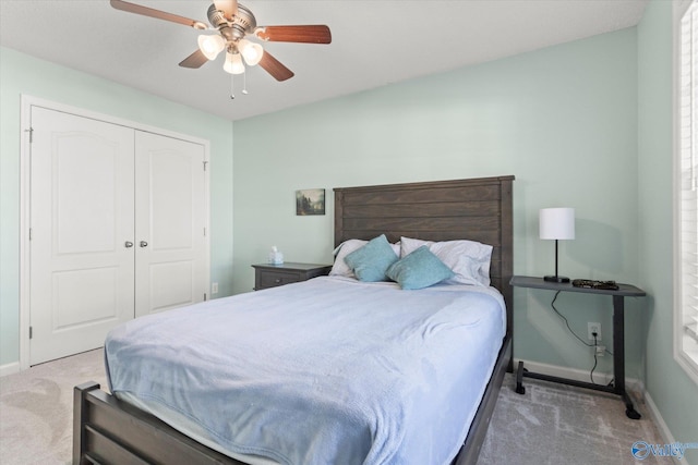 bedroom featuring carpet, ceiling fan, and a closet