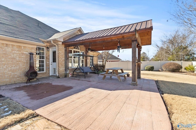 view of patio featuring ceiling fan