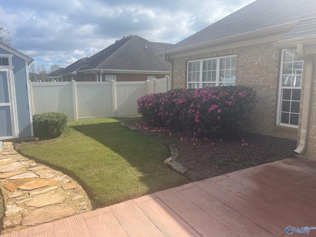 view of yard with a wooden deck