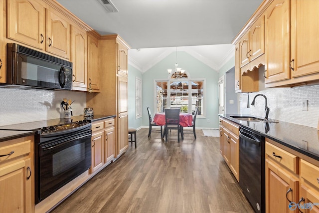 kitchen featuring lofted ceiling, sink, an inviting chandelier, ornamental molding, and black appliances