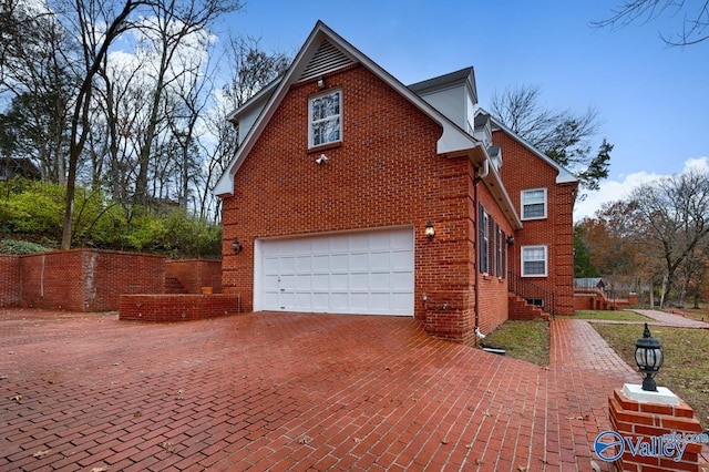 view of side of home with a garage