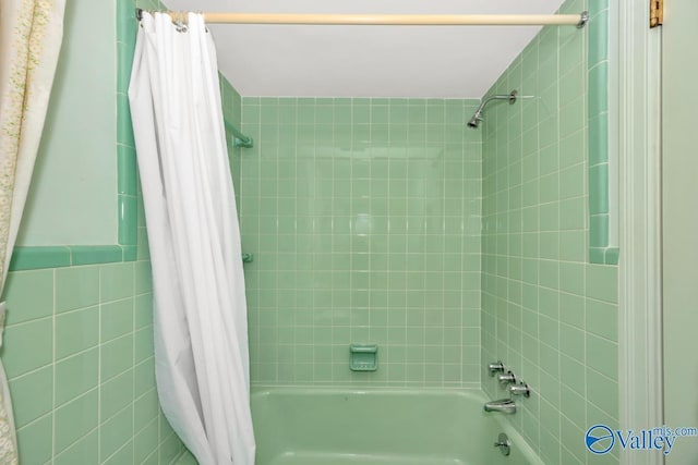 bathroom featuring shower / bath combination with curtain