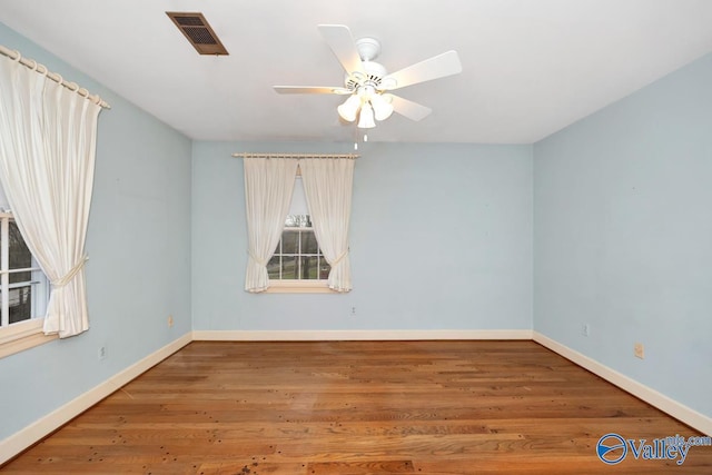 empty room featuring ceiling fan and wood-type flooring