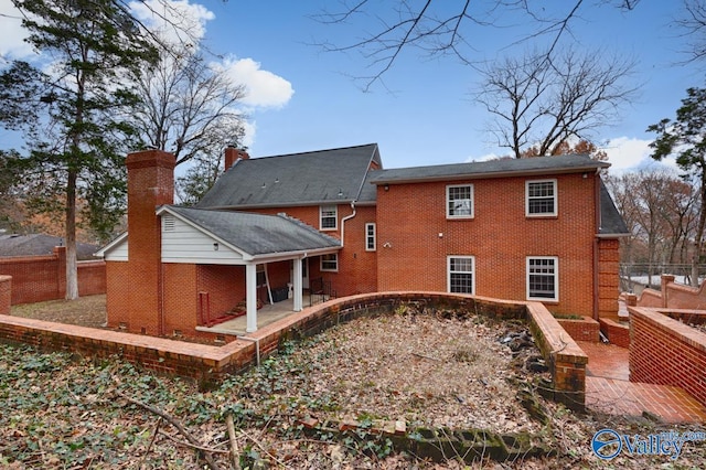 back of property with a patio area