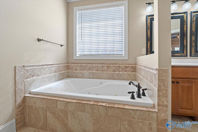 full bathroom featuring vanity and a whirlpool tub