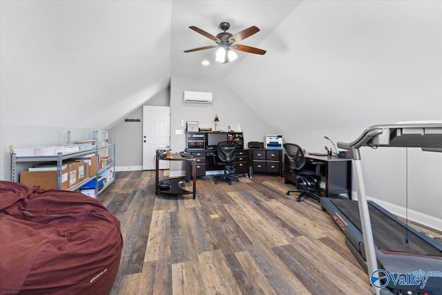 home office with vaulted ceiling, a wall mounted air conditioner, wood finished floors, and baseboards