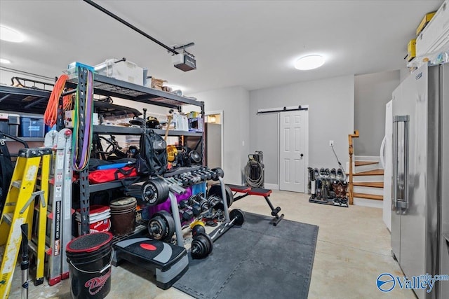 garage with high end fridge and a garage door opener