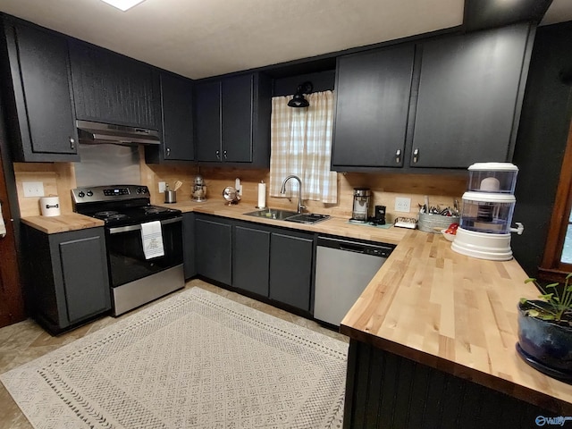 kitchen with range hood, stainless steel appliances, sink, and wood counters