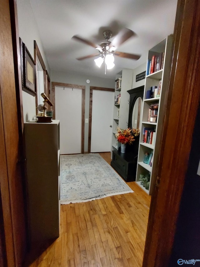 bedroom featuring light hardwood / wood-style flooring and ceiling fan