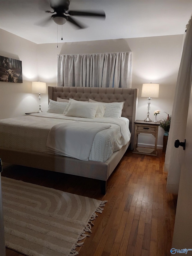 bedroom featuring ceiling fan and hardwood / wood-style flooring