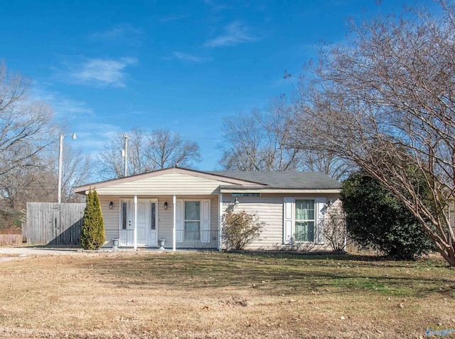 ranch-style home with a porch and a front yard