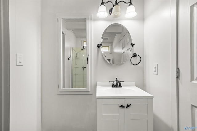 bathroom featuring walk in shower and vanity