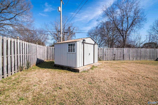 view of outbuilding with a yard