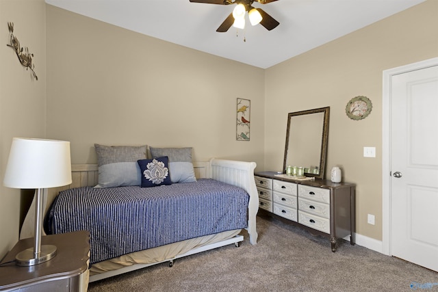 carpeted bedroom with baseboards and ceiling fan