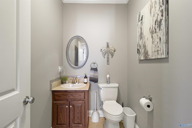 half bathroom with toilet and vanity