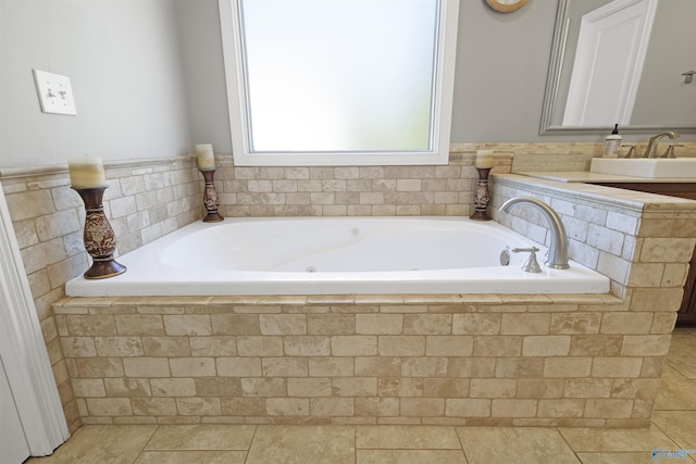 bathroom with a sink, a bath, and tile patterned flooring