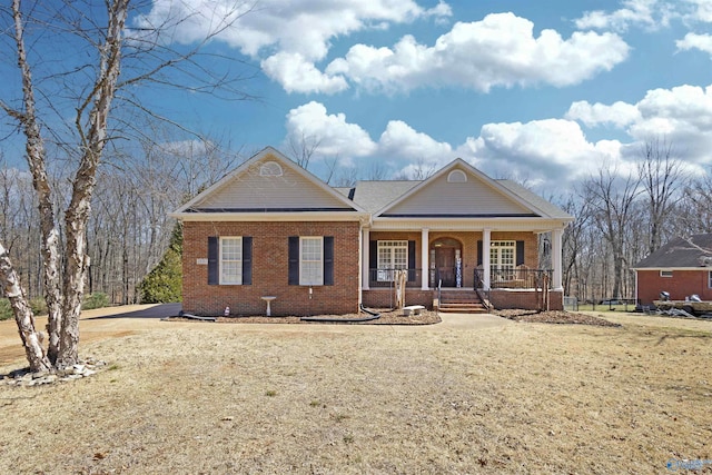 view of front of property with brick siding and covered porch