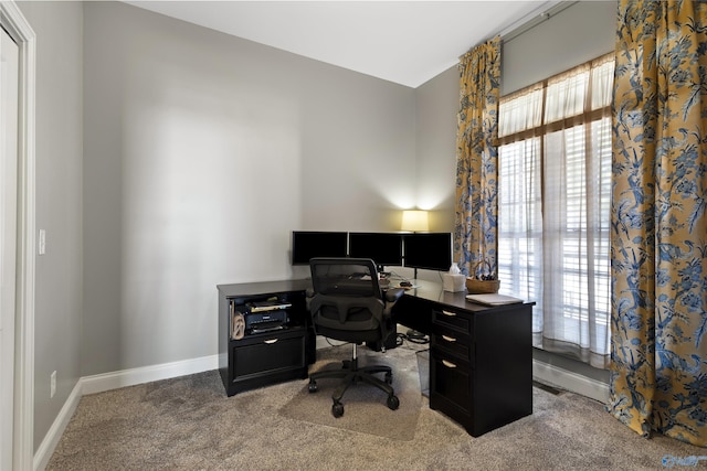 carpeted office with baseboards