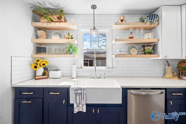 kitchen with open shelves, blue cabinetry, a sink, stainless steel dishwasher, and tasteful backsplash