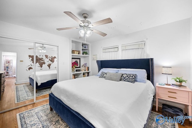 bedroom featuring a closet, ceiling fan, and wood finished floors