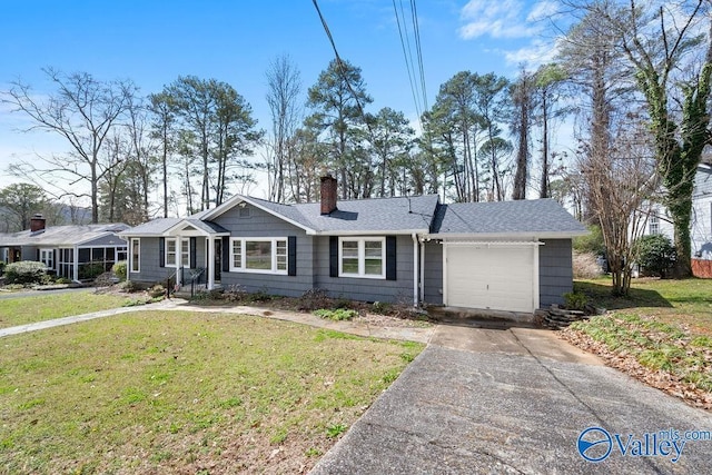 ranch-style house with a shingled roof, a front lawn, a chimney, a garage, and driveway