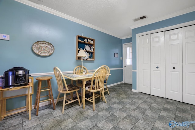 dining space with crown molding