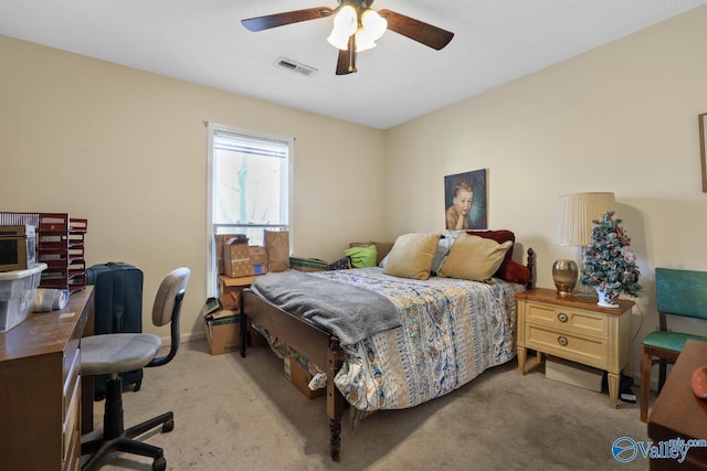 bedroom featuring ceiling fan and light colored carpet