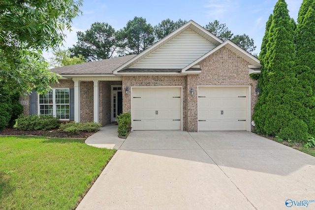 117 Somerset Park Dr NE, Huntsville, AL 35811 - ranch-style home featuring concrete driveway, an attached garage, a front lawn, brick siding, and a shingled roof