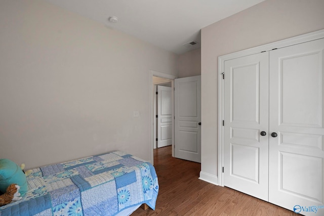 117 Somerset Park Dr NE, Huntsville, AL 35811 - bedroom featuring wood finished floors and a closet
