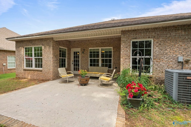 117 Somerset Park Dr NE, Huntsville, AL 35811 - rear view of house with a patio, central AC unit, and brick siding