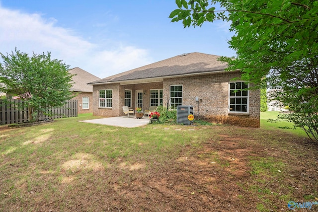117 Somerset Park Dr NE, Huntsville, AL 35811 - back of house with a patio area, central AC, and a shingled roof